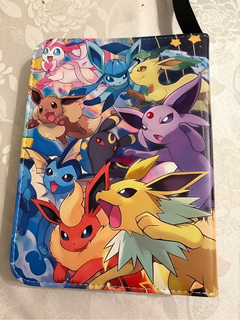 Pokémon card binder with 50 sleeves, wrist strap & zip Closure